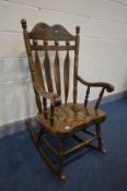 A MODERN OAK ROCKING CHAIR, (condition - scratches to seat and marks to the arms