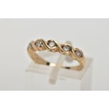 A 9CT GOLD DIAMOND HALF ETERNITY RING, designed with a row of five round brilliant cut diamonds,