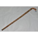 A SECOND WORLD WAR INTEREST WALKING STICK, the handle with aluminium tip, late Victorian