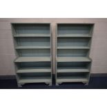 A PAIR OF GREEN PAINTED WATERFALL OPEN BOOKCASE, each with four shelves, width 97cm x depth 38cm x