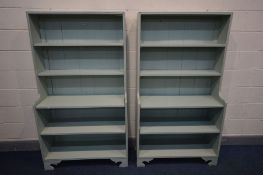 A PAIR OF GREEN PAINTED WATERFALL OPEN BOOKCASE, each with four shelves, width 97cm x depth 38cm x