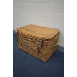 A LARGE WICKER BASKET, with twin handles, width 90cm x depth 62cm x height 54cm