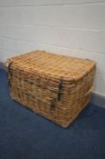 A LARGE WICKER BASKET, with twin handles, width 90cm x depth 62cm x height 54cm