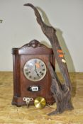 AN EARLY 20TH CENTURY OAK CASED BRACKET CLOCK, swan neck pediment over a circular silvered dial,