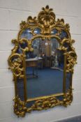 A REPRODUCTION ITALIAN GILT FRAMED WALL MIRROR, 98cm x 140cm