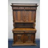 AN EARLY 20TH CENTURY FRENCH WALNUT BUFFET/CABINET, with blind fretwork detail, comprising of two