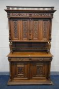 AN EARLY 20TH CENTURY FRENCH WALNUT BUFFET/CABINET, with blind fretwork detail, comprising of two