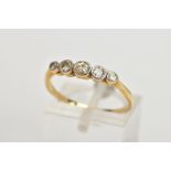 A YELLOW METAL HALF ETERNITY DIAMOND RING, designed with a row of five graduated round brilliant cut