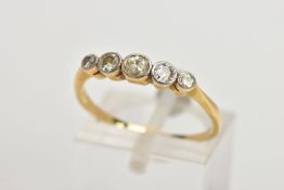 A YELLOW METAL HALF ETERNITY DIAMOND RING, designed with a row of five graduated round brilliant cut