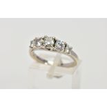 A 9CT WHITE GOLD FIVE STONE RING, designed with a row of five graduated, circular cut, colourless