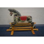 A BESPOKE TRESTLE ROCKING HORSE, on a pine stand, length 148cm x depth 59cm x height 97cm (condition