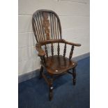 A REPRODUCTION ELM WINDSOR ARMCHAIR, with outswept armrests