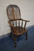 A REPRODUCTION ELM WINDSOR ARMCHAIR, with outswept armrests