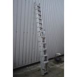 A SET OF DOUBLE EXTENSION LADDERS with attached wheels, length 382cm together with a set of Black