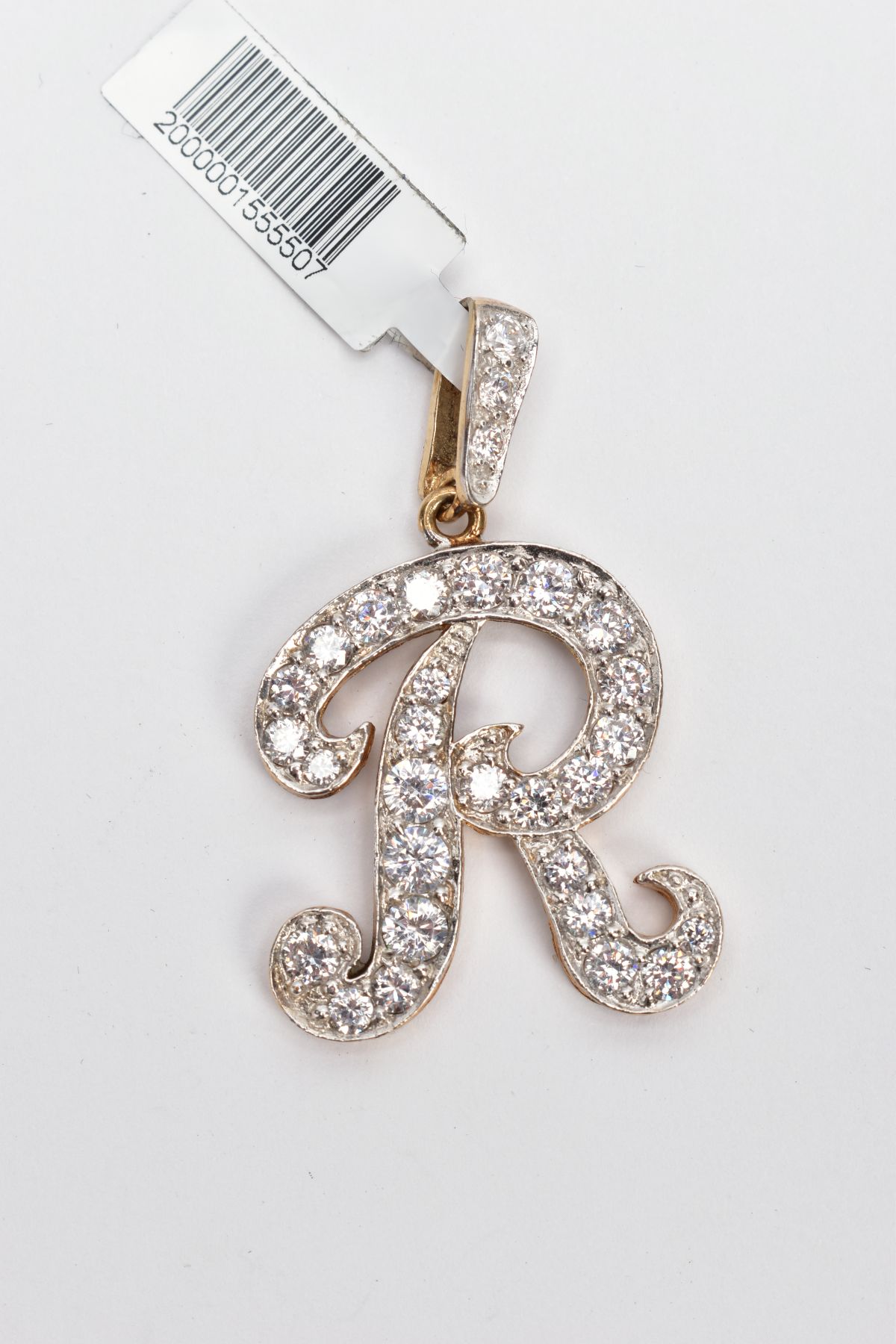 A 9CT GOLD CUBIC ZIRCONIA SET INITIAL 'R' PENDANT, large initial 'R' set with colourless cubic