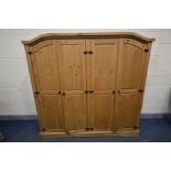 A CORONA PINE FOUR DOOR WARDROBE, width 195cm x depth 56cm x height 187cm