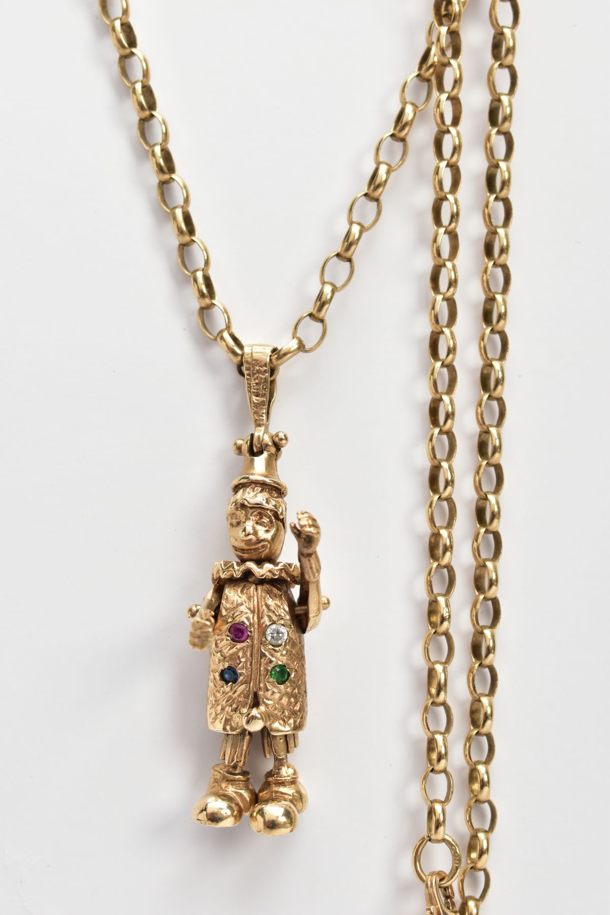 A 9CT GOLD CLOWN PENDANT AND CHAIN, the articulated clown set with four stones to the body, fitted - Image 2 of 4