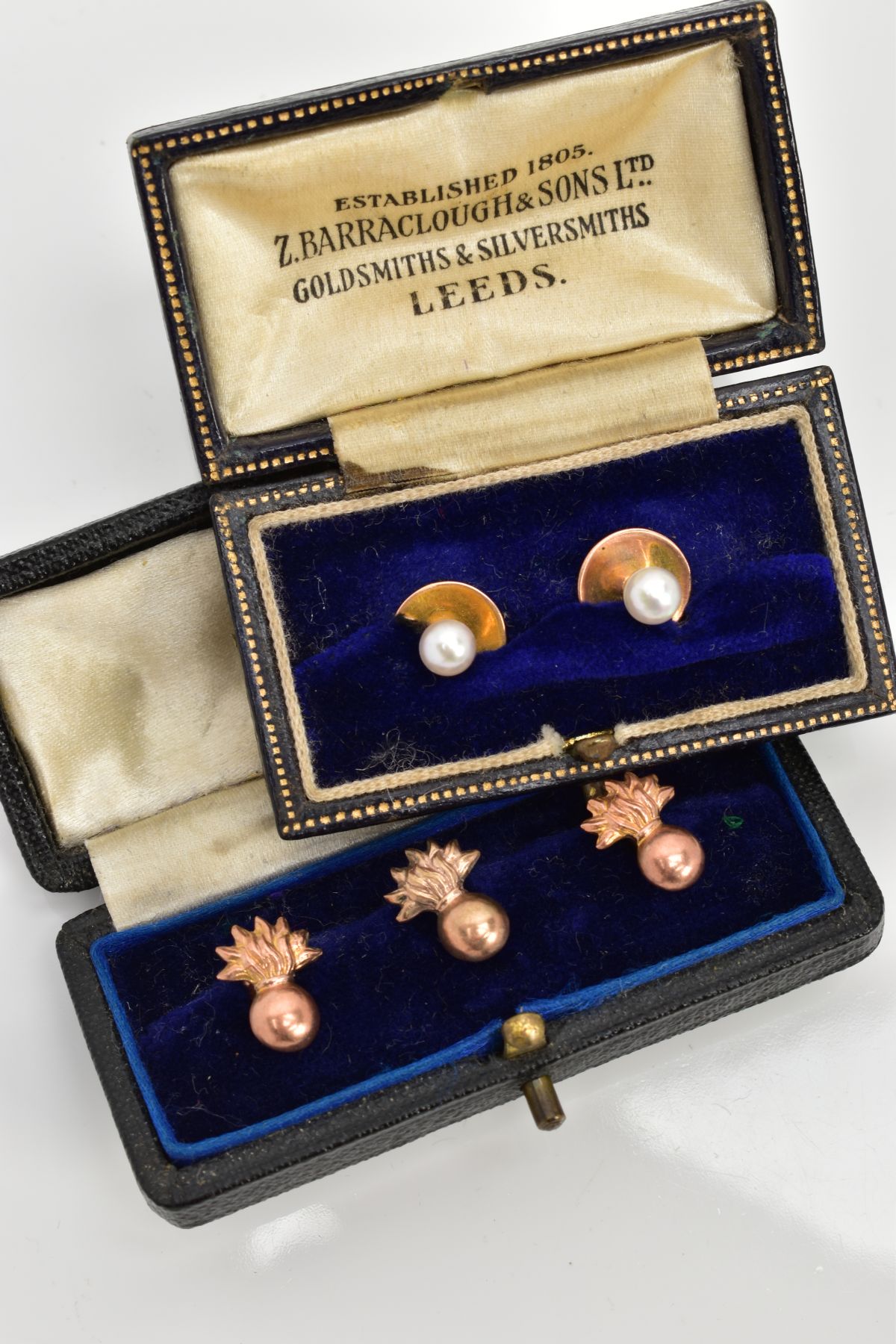 THREE ROSE GOLD COLLAR STUDS AND TWO PEARL STUDS, the three of a ball and flame design, two