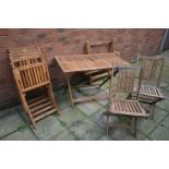 A SET OF SIX WOODEN SLATTED FOLDING DECK CHAIRS together with two matching wooden folding tables,
