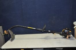 A McCULLOCK TRIMAC PETROL STRIMMER (engine pulls freely but hasn't been started)