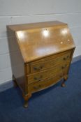 A REPRODUCTION BURR WALNUT BUREAU, with a fitted interior, three drawers, on cabriole legs, width