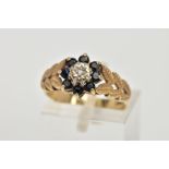 A 9CT GOLD SAPPHIRE AND DIAMOND CLUSTER RING, designed with a star set, single cut diamond, within a