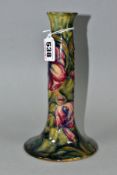 A WILLIAM MOORCROFT SPANISH PATTERN CANDLESTICK, of ogee inverted trumpet form, mottled green/blue