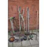 A COLLECTION OF GARDEN TOOLS to include forks, spades, hoe etc together with a small quantity of