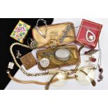 A BAG OF ASSORTED ITEMS, to include a cased pair of folding glasses, a pair of yellow metal framed