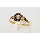 A VICTORIAN, DIAMOND AND BLACK ENAMEL MEMORIAL RING, centring on a star set, old cut diamond