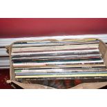 A BAG CONTAINING TWENTY NINE LPs OF ROCK MUSIC artists include Led Zepplin, Wishbone Ash, Black