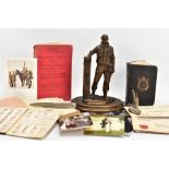 A BOX CONTAINING VARIOUS MILITARY ITEMS, to include a copy of the Soldiers Bible, which is