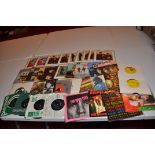 A SINGLES CASE CONTAINING APPROX THIRTY FIVE SINGLES AND EPs by The Beatles and the Rolling Stones