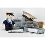 A BOX CONTAINING VARIOUS MILITARY ITEMS (NAVAL INTEREST), to include two De-agostini scale models of