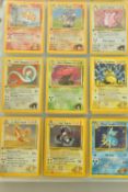 THE COMPLETE POKEMON CARDS GYM HEROES SET, containing mostly first edition cards. First editions