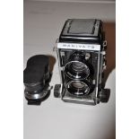 A MAMIYA CS PROFESSIONAL TLR CAMERA fitted with a pair of 80mm lenses and a pair of 135mm lenses