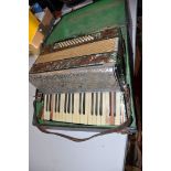 A MAZZINI ANTORIA GERMAN MADE PIANO ACCORDIAN with 34 keys and 48 buttons ( distressed with losses)