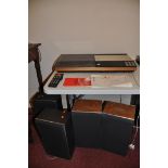A BANG AND OLUFSEN BEOCENTRE 7000 VINTAGE MUSIC CENTRE with a pair of X35 speakers (working) a