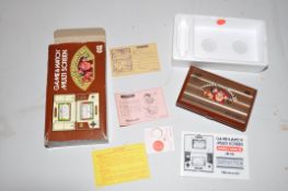 A NINTENDO CGL JR-55 GAME AND WATCH MULTISCREEN DONKEY KONG 2 gaming console with instructions,