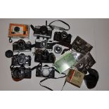 A COLLECTION OF VINTAGE CANON CAMERAS AND ACCESSORIES including two A1, and AE1, and AE1P, an FTb, a