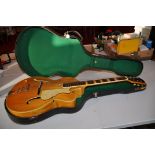 A HOFNER PRESIDENT JAZZ GUITAR in natural finish with a Spruce to Flame Maple back and sides,