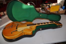A HOFNER PRESIDENT JAZZ GUITAR in natural finish with a Spruce to Flame Maple back and sides,