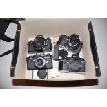 A TRAY CONTAING FOUR NIKON F3 FILM SLR CAMERA two fitted with 50mm f 1.8 lenses, one with a 35-