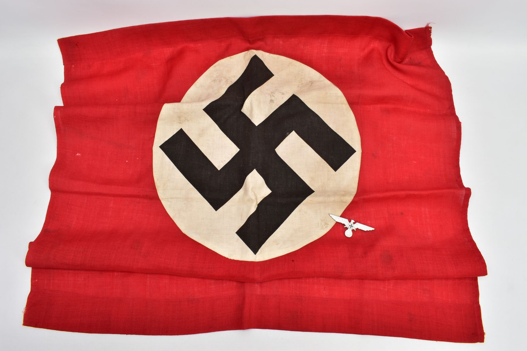 THIRD REICH GERMAN ITEMS, a 90cm x 90cm approximate banner, Nazi with offset Swastika logo, but no