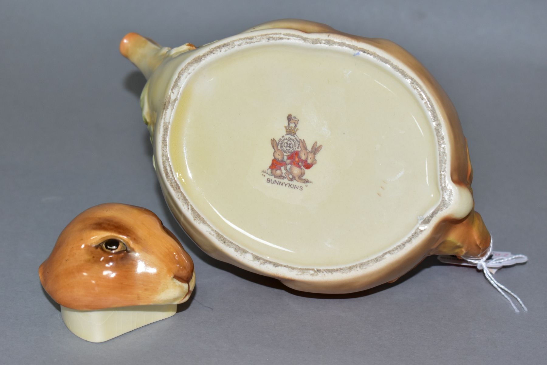 A 1930'S/40'S ROYAL DOULTON BUNNYKINS EARTHENWARE TEAPOT, D6010, designed by Charles Noke, shaped as - Image 5 of 5