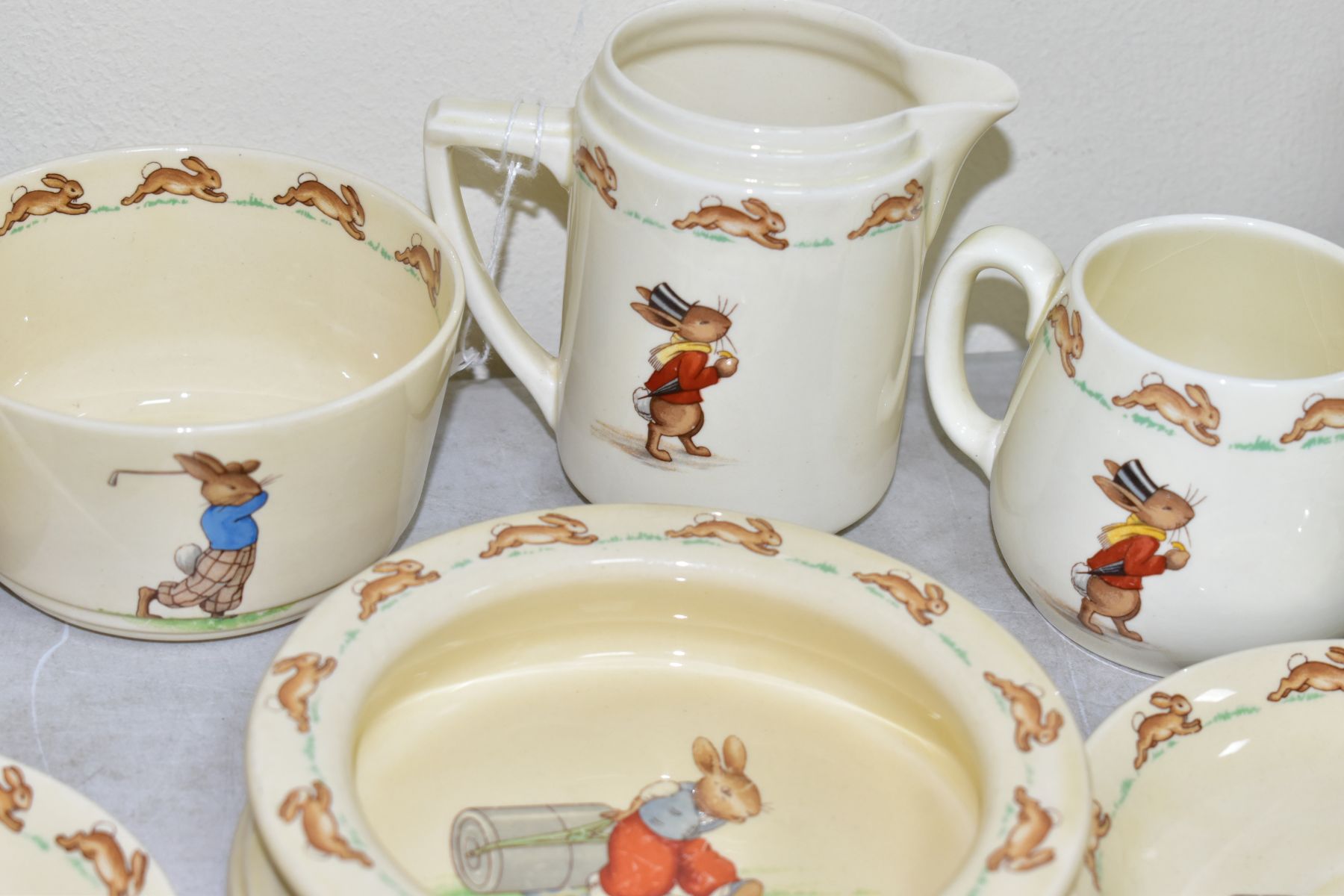 THIRTEEN PIECES OF ROYAL DOULTON BUNNYKINS EARTHENWARE TABLEWARES OF PRESSING TROUSERS SCENE HW14 BY - Image 11 of 13