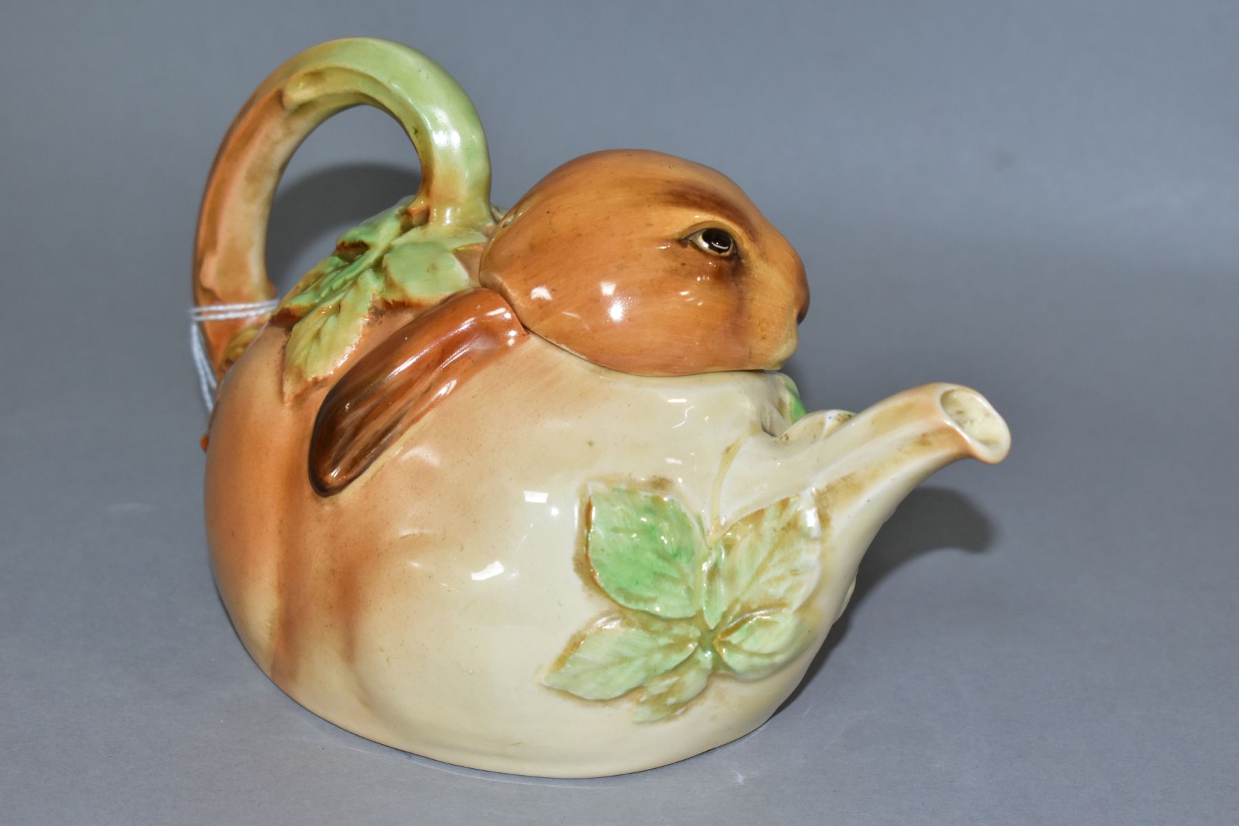 A 1930'S/40'S ROYAL DOULTON BUNNYKINS EARTHENWARE TEAPOT, D6010, designed by Charles Noke, shaped as - Image 2 of 5
