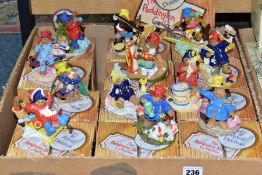 A SET OF TWELVE BOXED ROYAL DOULTON PADDINGTON BEAR COLLECTION FIGURES, comprising At The Station