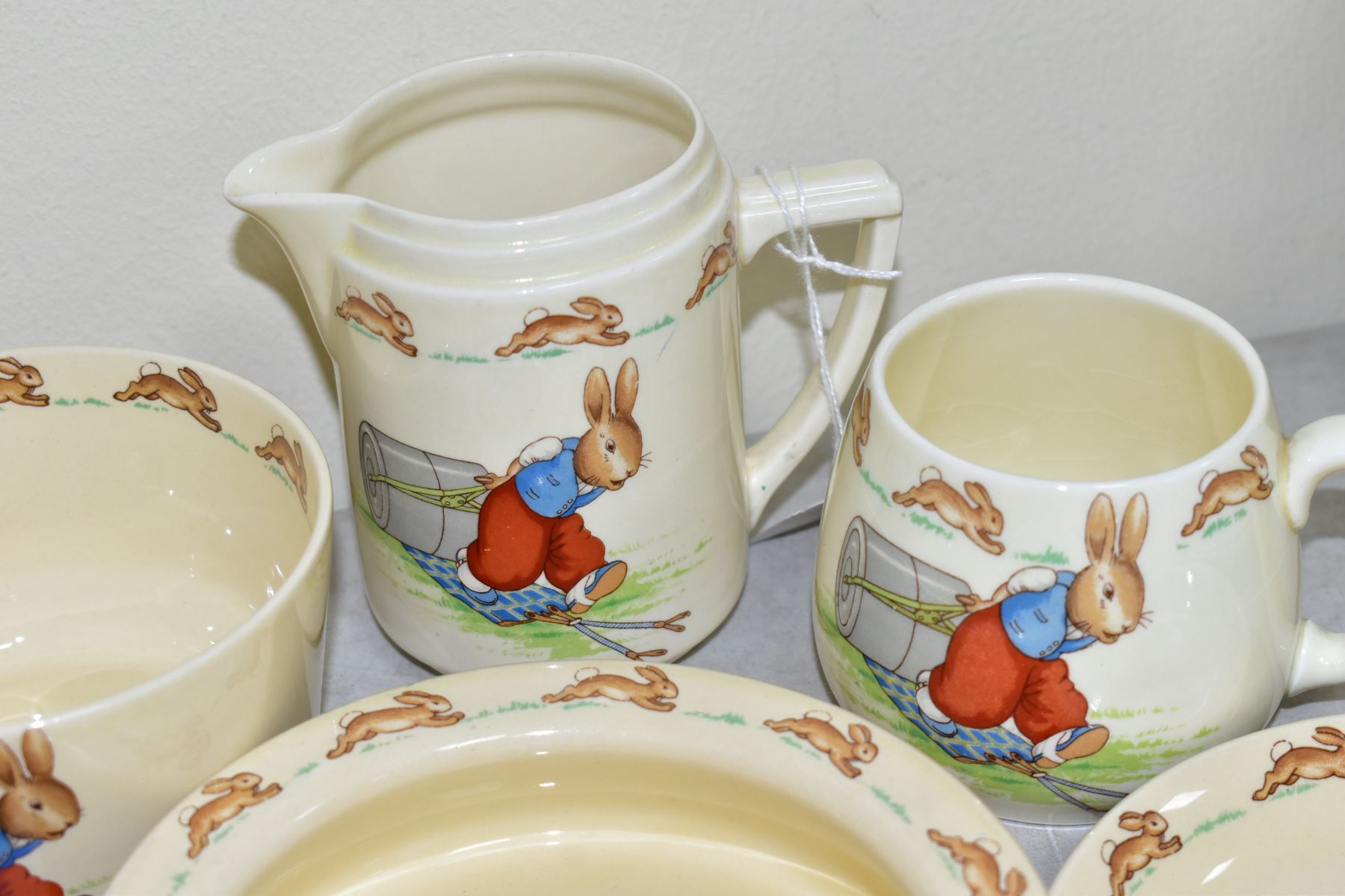 THIRTEEN PIECES OF ROYAL DOULTON BUNNYKINS EARTHENWARE TABLEWARES OF PRESSING TROUSERS SCENE HW14 BY - Image 7 of 13