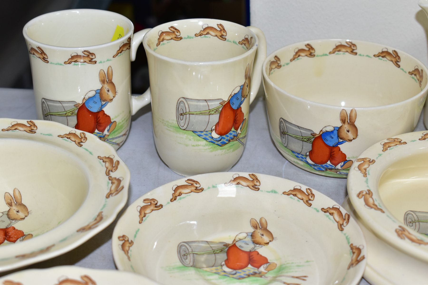 THIRTEEN PIECES OF ROYAL DOULTON BUNNYKINS EARTHENWARE TABLEWARES OF PRESSING TROUSERS SCENE HW14 BY - Image 8 of 13